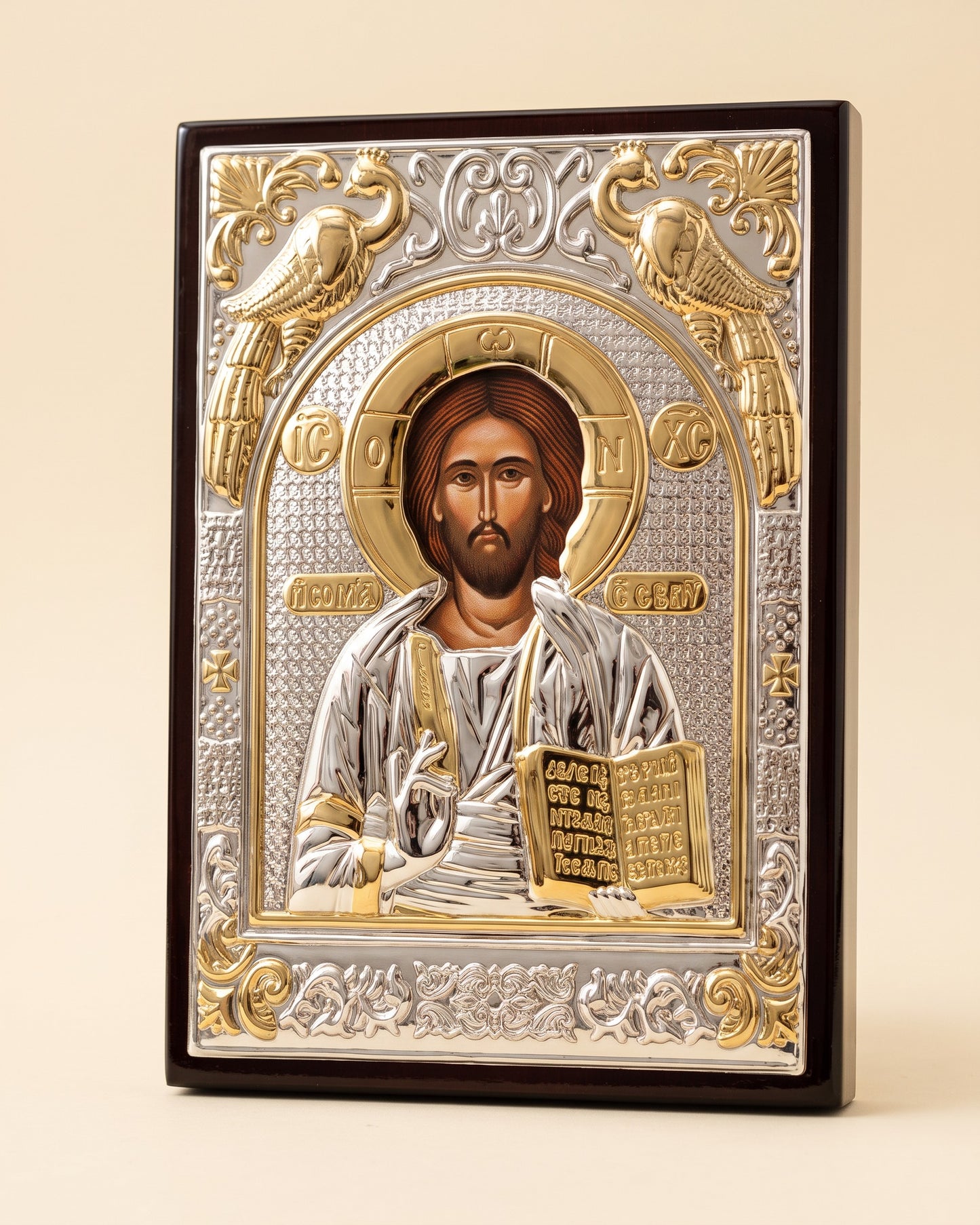 Close view of the embossed silver and gold relief