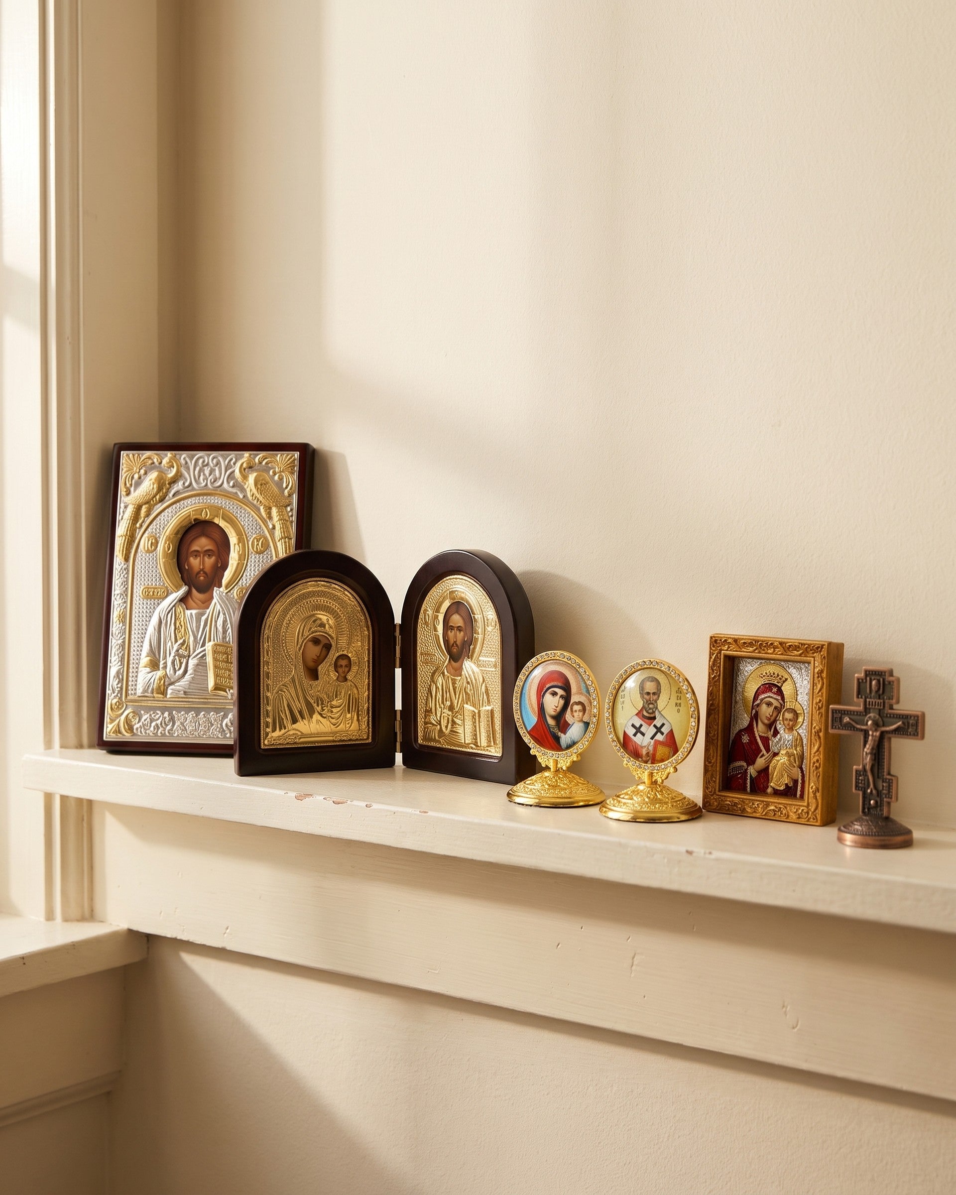 The five pieces arranged along a shelf in a bright room