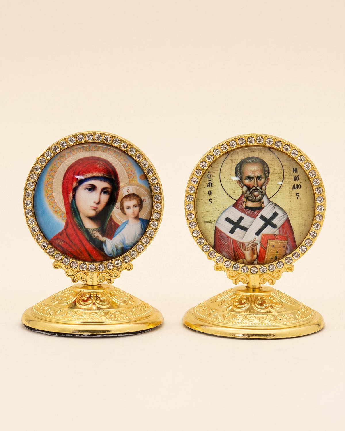 Pair of standing icon ornaments with rhinestone borders on gold pedestal bases