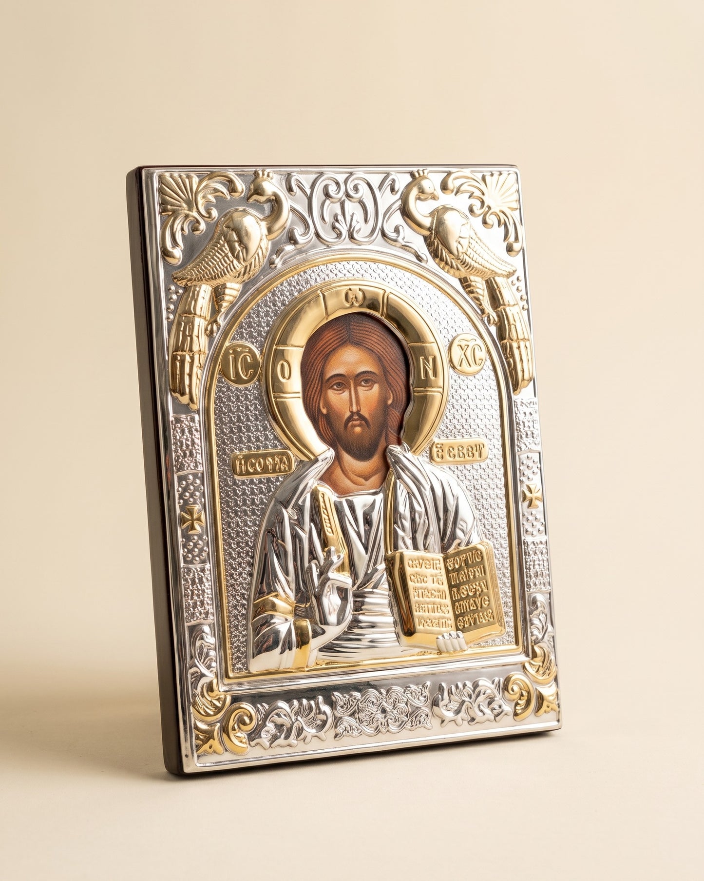 Christ Pantocrator silver relief icon on a lacquered wood panel