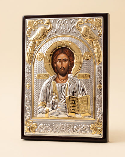 Close view of the embossed silver and gold relief