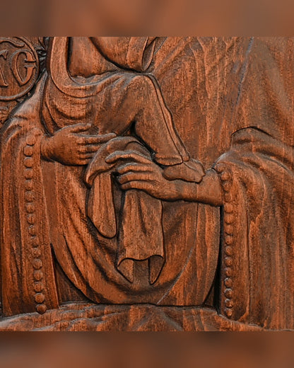 Close detail of the carved hand and drapery