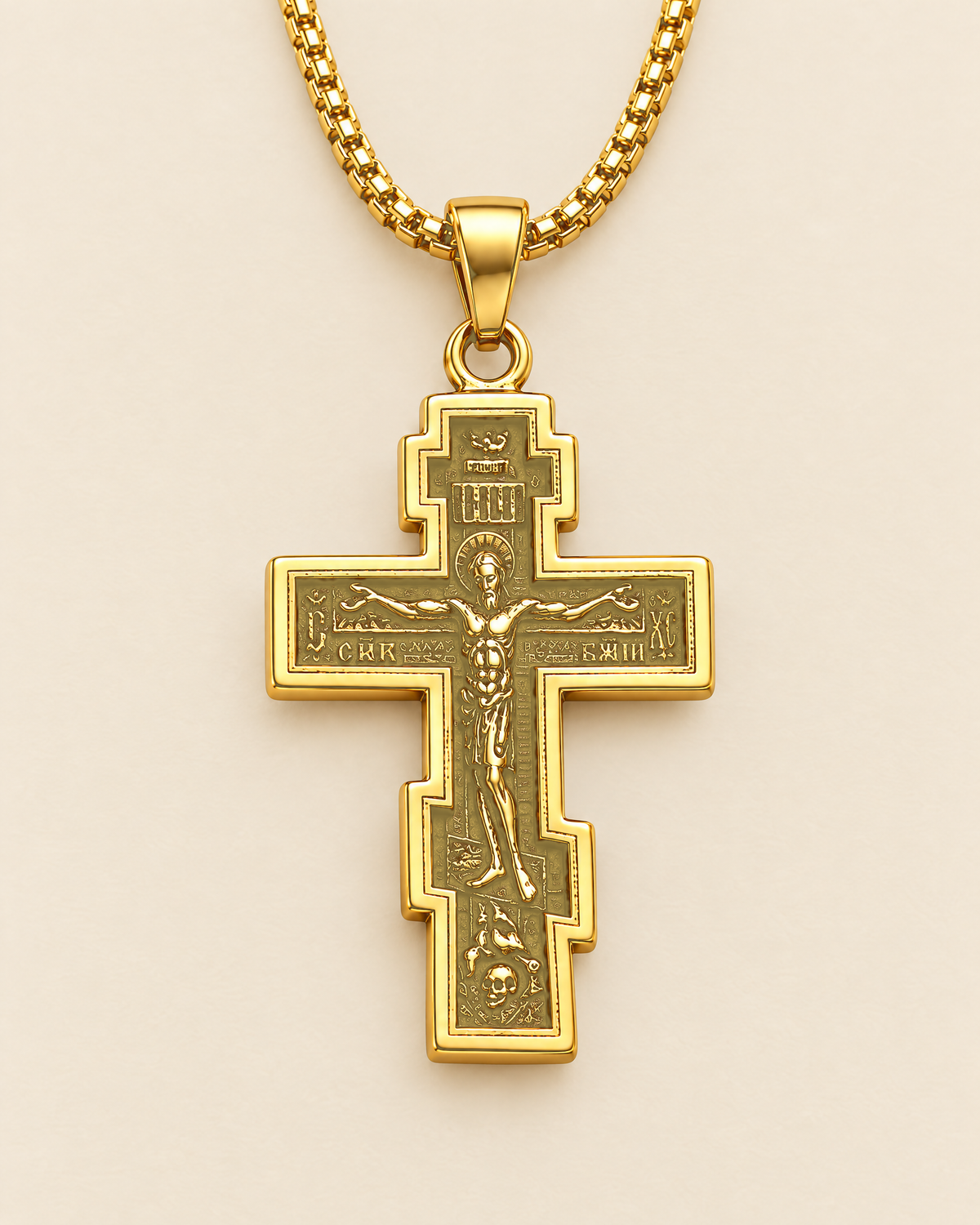 Gold stainless steel Orthodox cross pendant, solid gold tone, on its chain